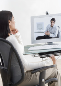 Businesswoman on Videoconference with Businessman