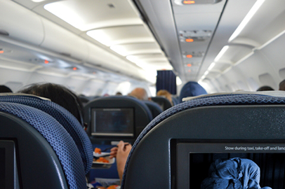 http://www.dreamstime.com/stock-photo-airplane-cabin-interior-passengers-entertainment-food-movie-image47528040
