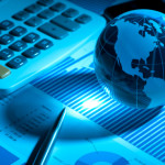 Globe with financial papers