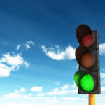 Green Traffic Lights against Blue Sky Backgrounds with clipping path