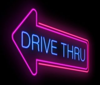 Illuminated neon drive thru sign.