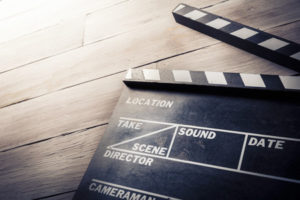 Photo of movie clapper on wood