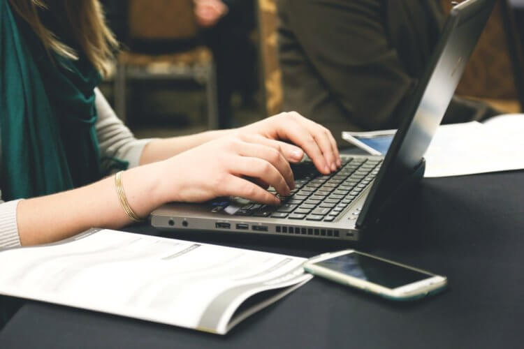 typing lawyer typing on laptop