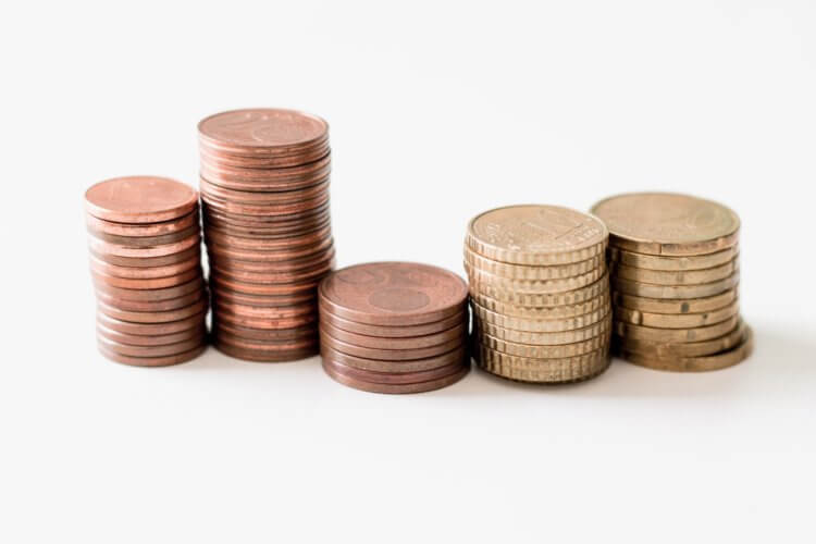 Law Firm Profit Sharing Formulas Photo of coins stacked symbolizing Law Firm profit sharing formulas